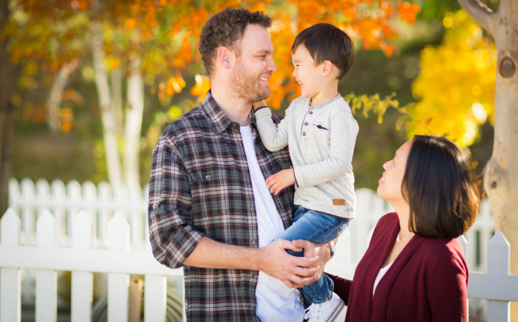 Outdoor Portrait of Mixed Race Chinese and Caucasian Parents and Child.